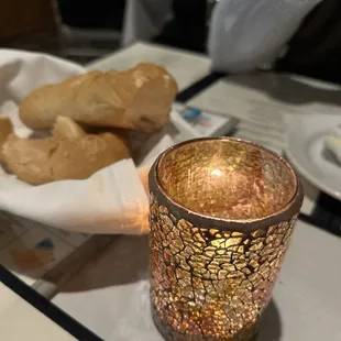 a candle and bread