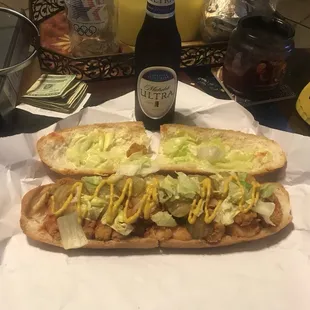two hot dogs with lettuce and mustard