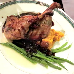 Duck Confit over sweet potato puree with red wine cherry sauce
