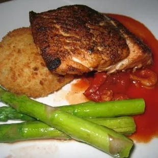 blackened salmon: with potato croquette, house vegetable and a roasted roma tomato crayfish sauce