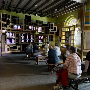 Visitors hearing stories of resilience in the the Hurricane Katrina exhibition at The Presbytère building of the Louisiana State Museum