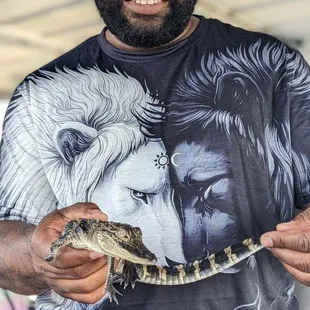 Holding a baby gator