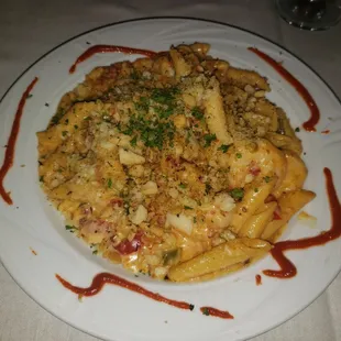 Daily special with grilled shrimp, crawfish tails, and andouille sausage cream sauce, topped with shaved parmesan. Yum!