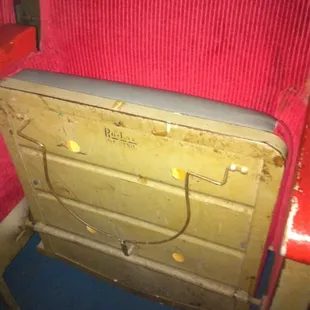 On underside of all the seats. Anyone know what this is for?