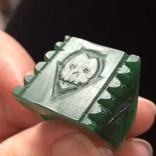 Wax carving of a ring.