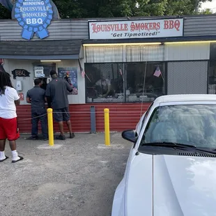 a car parked in front of a restaurant