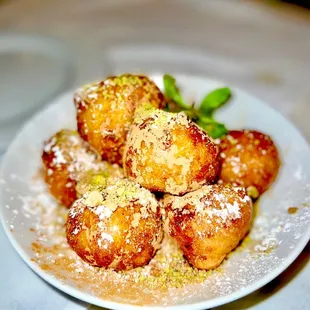 Loukoumades baby greek donuts, honey, cinnamon, walnuts, pistachio, micro mint