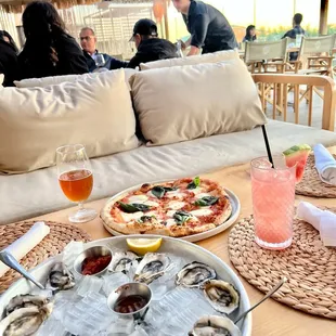 Oysters, Margherita pizza and cocktails