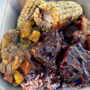 a tray of meat and rice