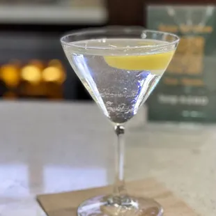 a glass of water with a lemon slice in it