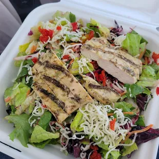 Chicken salad. Comes with mixed greens, carrots, radicchio, peppadew peppers, dried apricots, candied walnuts