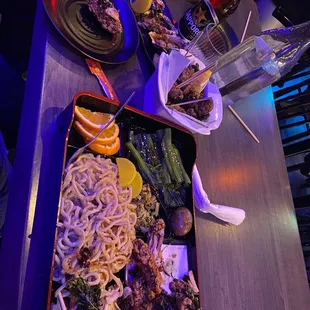 Garlic Butter BBQ Oyster on a Half Shell (4) Fried Baby Oysters Fried Chicken Leg Garlic Noodle Bento Salt Crisp Baby Octopus Soporro beer