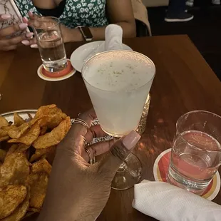 a person holding a glass of wine