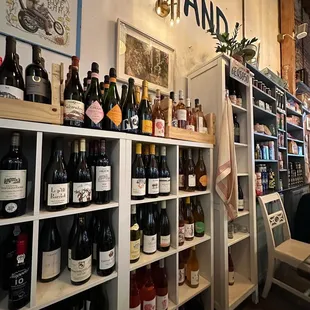 a shelf full of bottles of wine