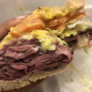 Hot pastrami on grilled rye, lettuce + tomato + mustard