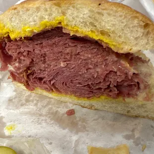 Half of a Regular Corned Beef Sandwich on an Onion Roll