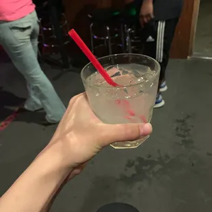 a person holding a glass of water