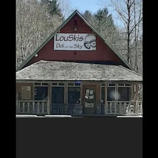 a red building with a sign on it