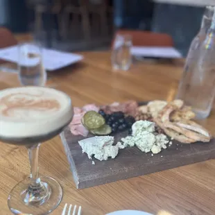 a plate of food and a glass of wine