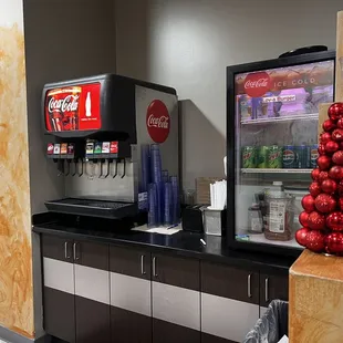 a refrigerated soda machine