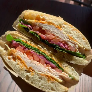 Turkey Sandwich  Toasted Ciabatta Bread with Chipotle, Spinach, Bacon, Red Onion, Fresh Tomato, Turkey, and Swiss Cheese