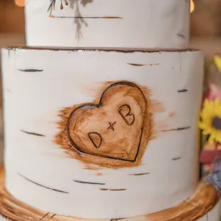 a heart carved into a piece of wood