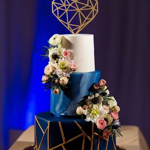 a blue and white wedding cake