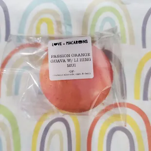 a single macaron wrapped in plastic