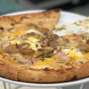 a pizza on a white plate