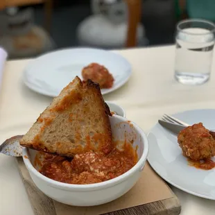 a bowl of spaghetti and meatballs