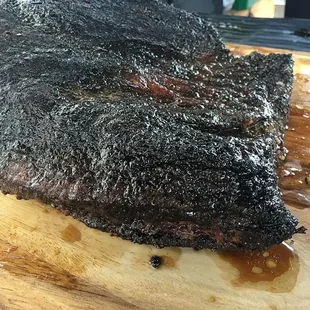 Our freshly smoked beef brisket, all barked up and ready to slice its juicy goodness!
