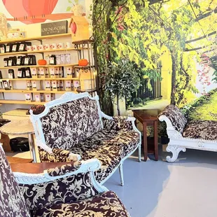 a living room with a wall mural