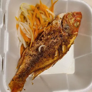 Fried red snapper, made to order, with pickeled onions and habanero peppers. Amazing.