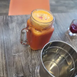 a jar of juice on a table