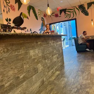 a man sitting on a couch in a restaurant