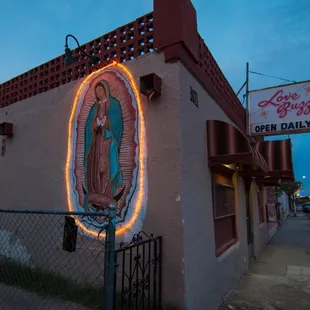 a neon sign on the side of a building