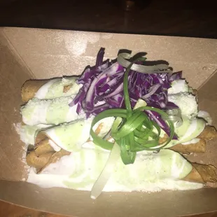 Flautas. Solid snack w great cream sauce. Not a lot of meat tho.