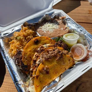 3 Birria Tacos,consume (not in photo), Beans, Rice and 2 sauces $15