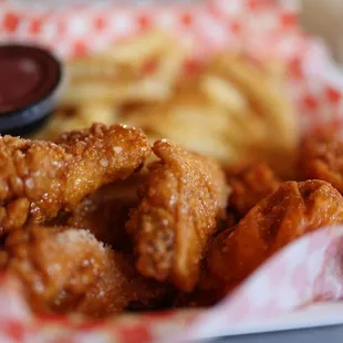 a basket of fried chicken and french fries