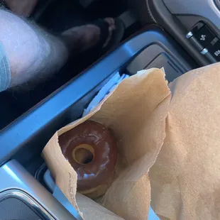 a donut in a paper bag