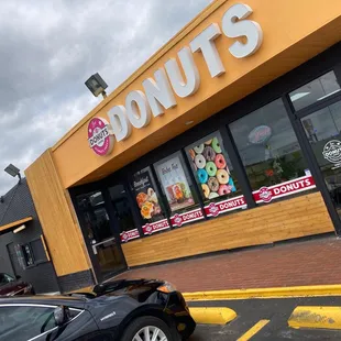 a car parked in front of a donut shop