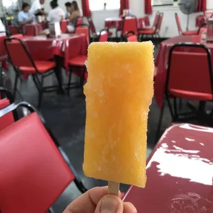 Paletas in the fridge to the left of the register.