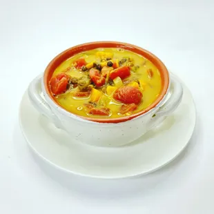 a bowl of soup on a plate