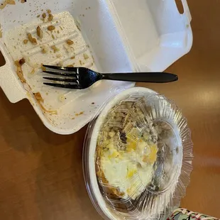 a half eaten meal in a styrofoam container