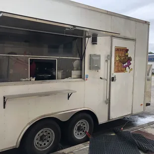 a food truck parked on the side of the road