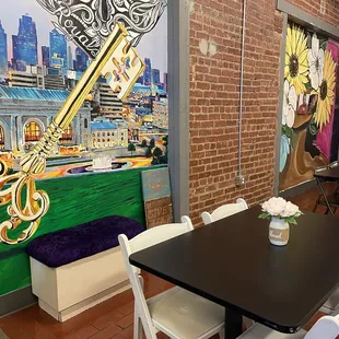 a dining room with a brick wall