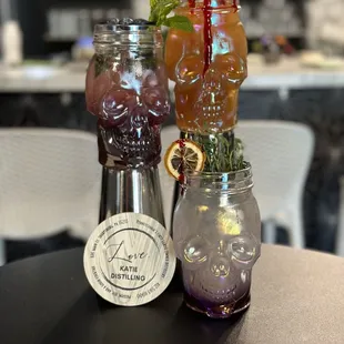 two jars of drinks on a table