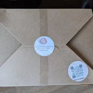 a brown envelope with a sticker on it