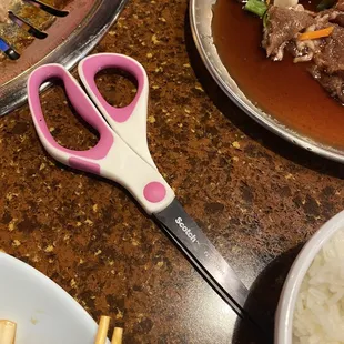 a pair of scissors on a table