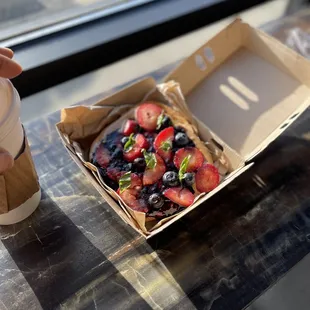 a box of fruit and a cup of coffee